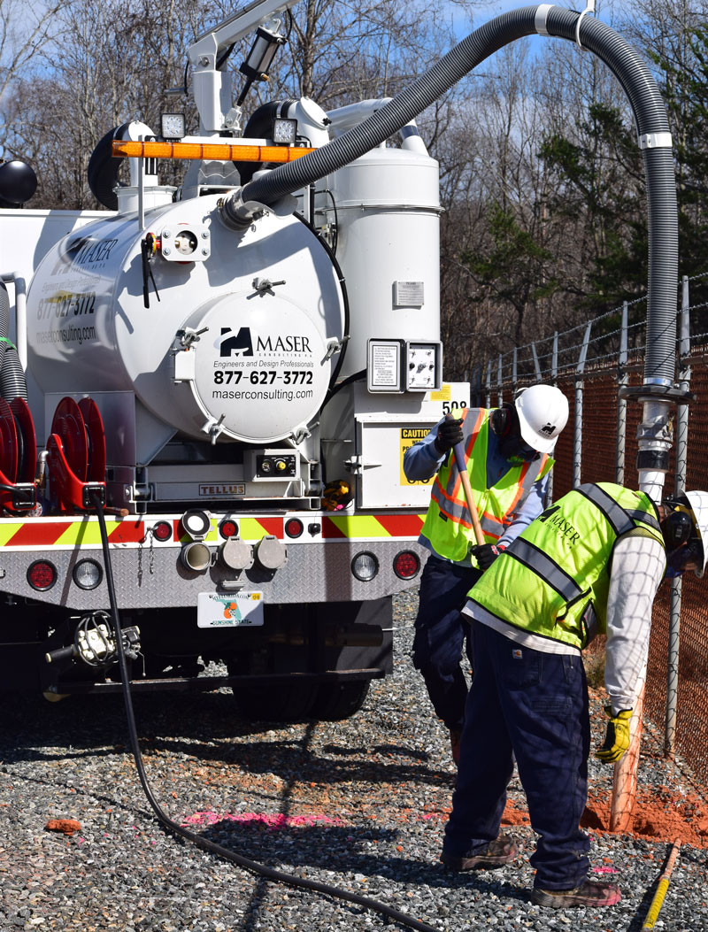 Vac truck locates underground utilities as part of subsurface utility engineering