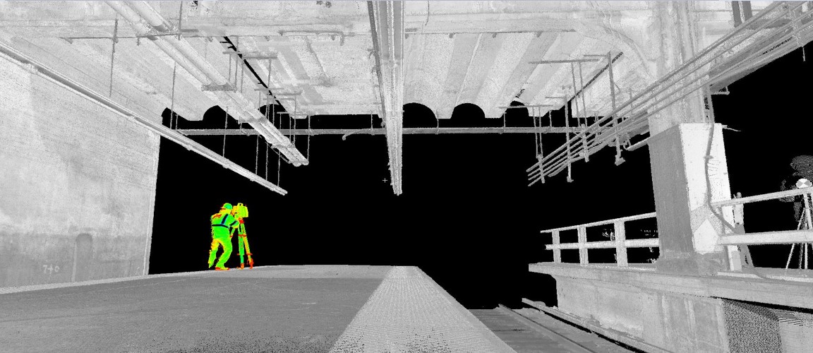 Scan of surveyor using a static scanner at rail facility
